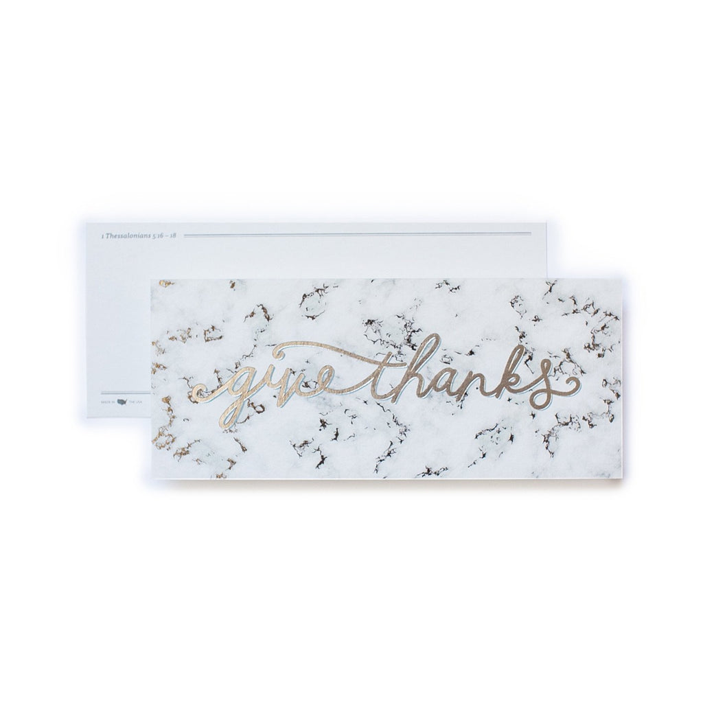 White bookmark with black marble background with gold foil script text saying,