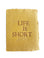 Mustard yellow card with brown and embossed text saying,