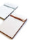 White notepad with gray text saying, “A world of possibility lies beyond the edge of the horizon” across the top.
