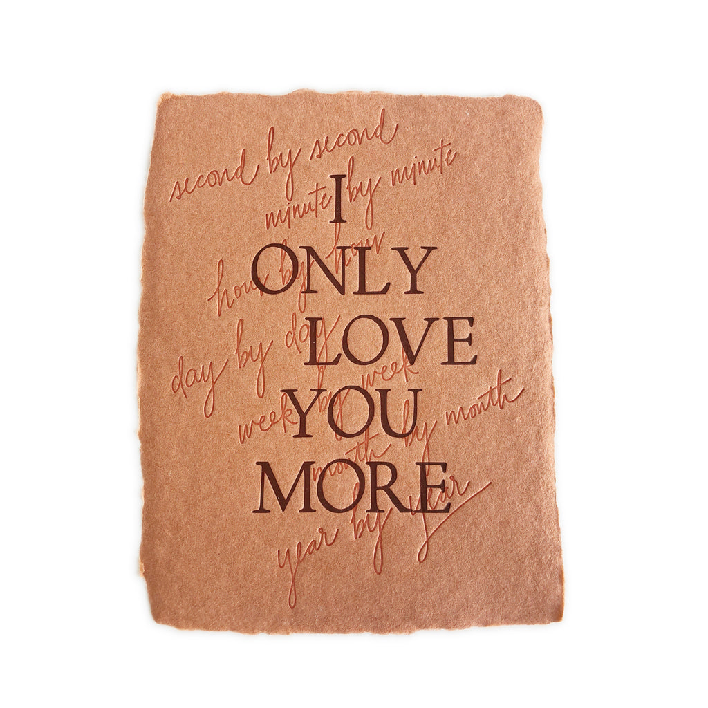 Rust orange card with torn edges and embossed brown text saying,