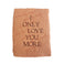 Rust orange card with torn edges and embossed brown text saying,