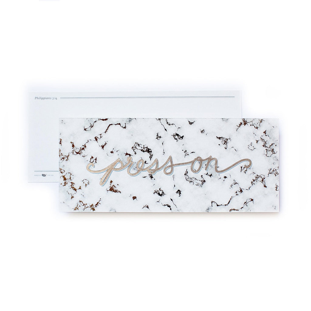 White bookmark with black marble background with gold foil script text saying,