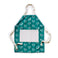 Teal bib apron with white inset square. Images of white teacups. White strap around neck and white strap ties around waist. White bib apron with teal inset square. Image of white teapots. Teal strap around neck and teal strap ties around waist.