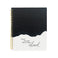 Torn edge notebook with black on top and ivory on the bottom. Black text saying, “Turn the Page-There’s More Ahead”. Gold coil binding on left side.