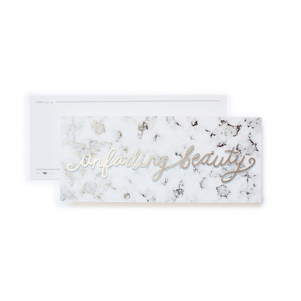 White bookmark with black marble background with gold foil script text saying,