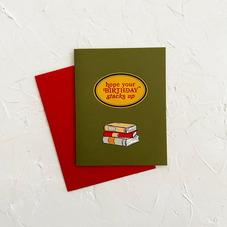 Greeting card with books illustration and text on a textured white background