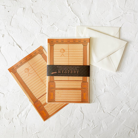 Letter writing pages with a bookcase design and mystery inspired icons